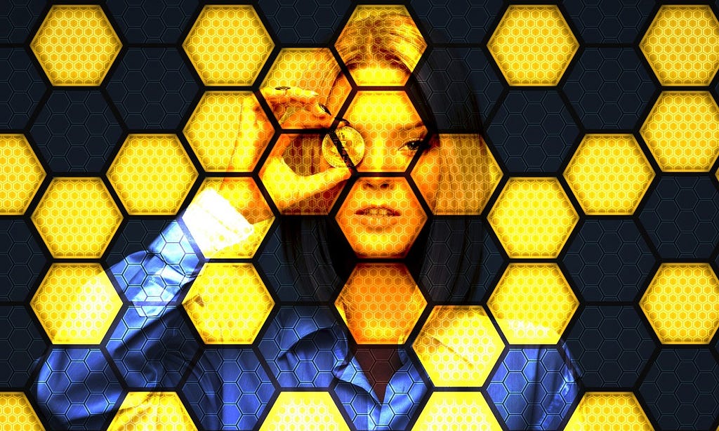 Woman holding a Gold coin on her eye. Honeycomb background picture