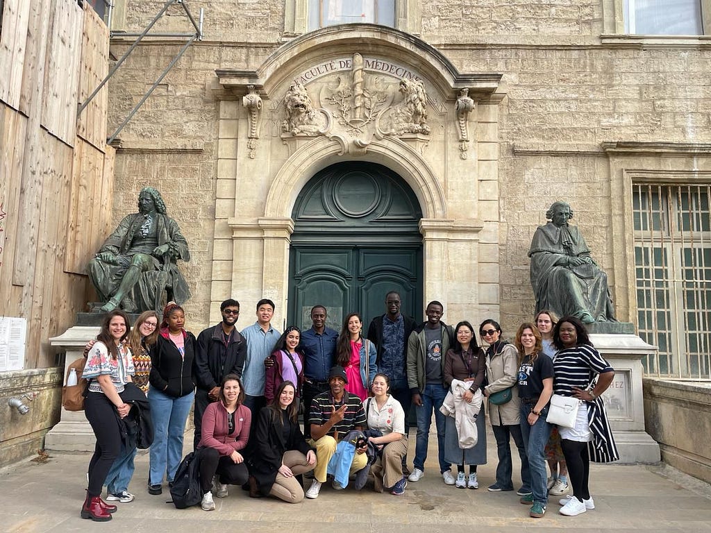 Doctoral students in front of the world’s oldest operation faculty of medicine in Montpellier