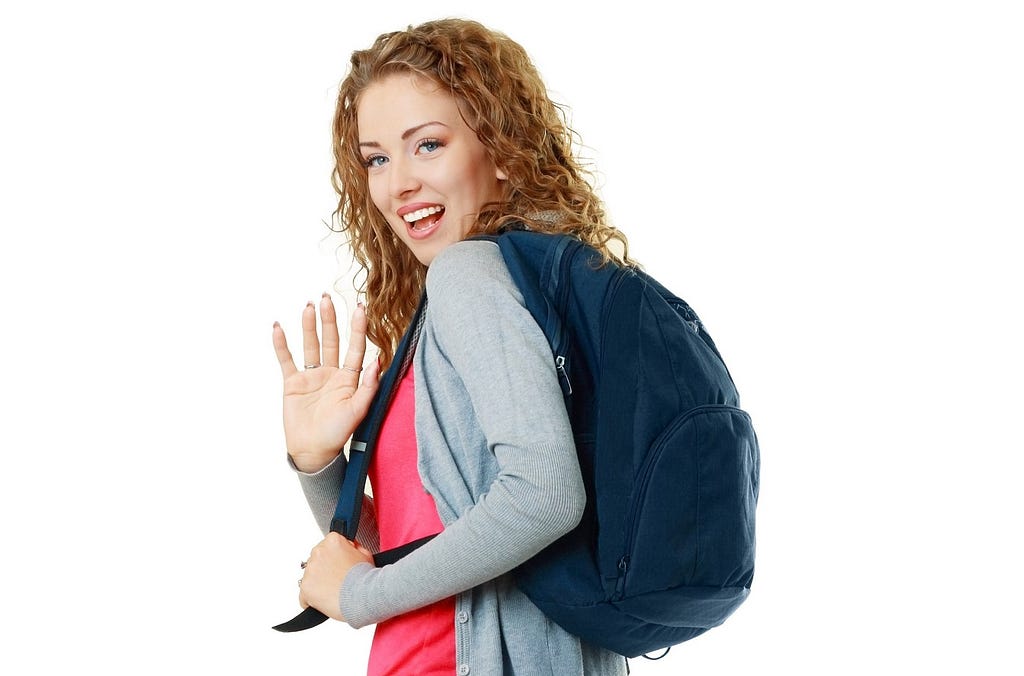 Young woman with a backpack sets a boundary by waving goodbye.