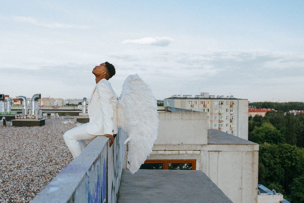 A Man in Angel Costume Contemplating