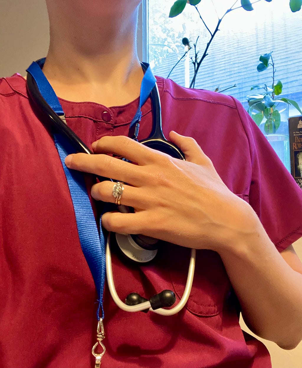 a doctor holding her stethescope