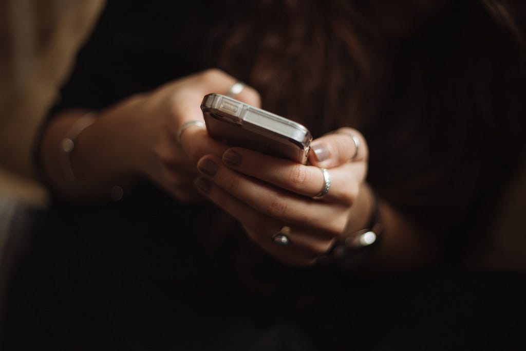 Hands holding a mobile phone