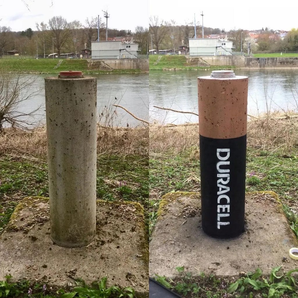 A concrete pole (left) is transformed with some paint by a street artist into a Duracell battery (right)