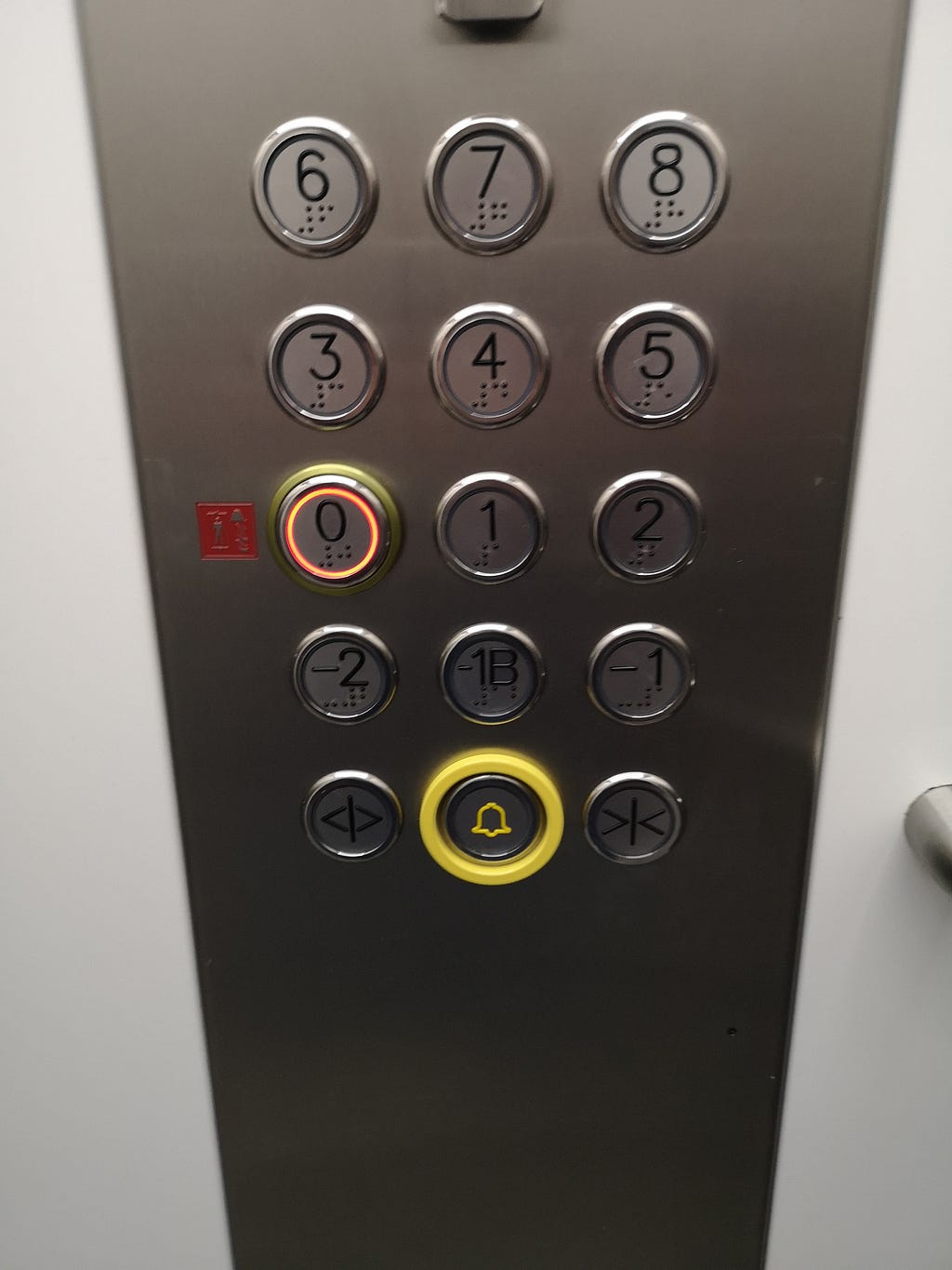 One of the hotel’s elevators with buttons arranged in a certain way. This has a 0 button to represent the entrance floor.