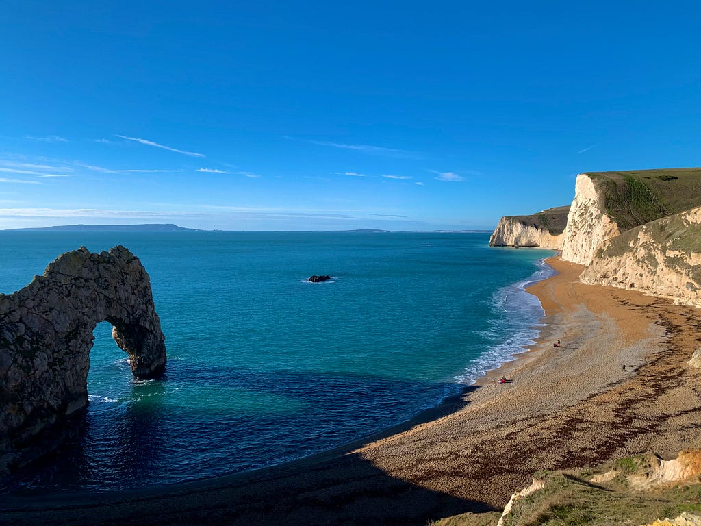 View of Durdle Door, a natural limestone arch on the Jurassic Coast near Lulworth in Dorset, England.