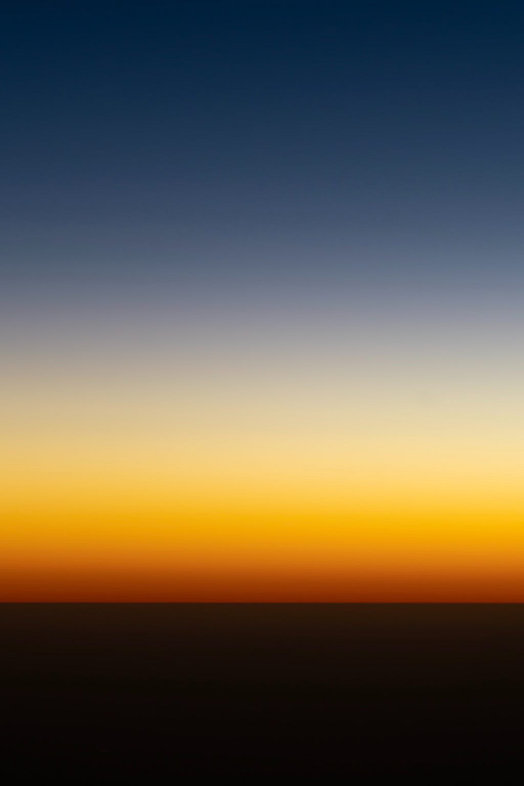 a gradient color change starting at the top with light blue, then yellow, as if to mimic the sky, finally landing on a dark brown