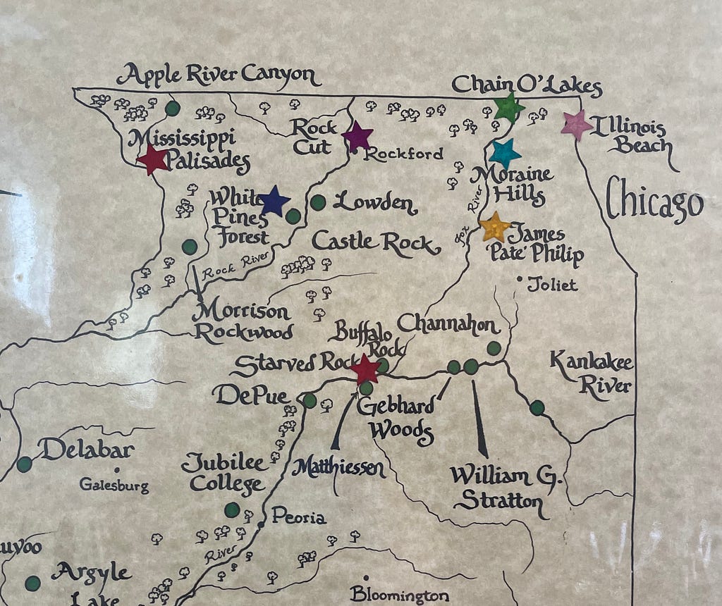 A hand-drawn map of the state of Illinois, with star stickers over a select number of parks.