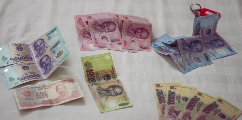 A photo of various denominations of Vietnamese Dong, the official currency of Vietnam