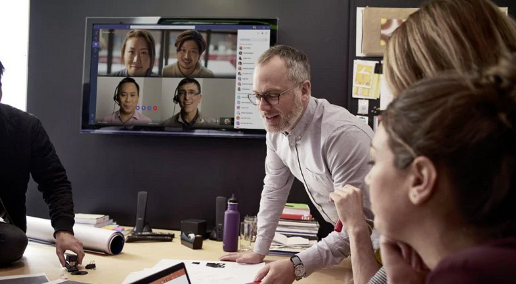 Team members discussing using Microsoft Teams and Skype