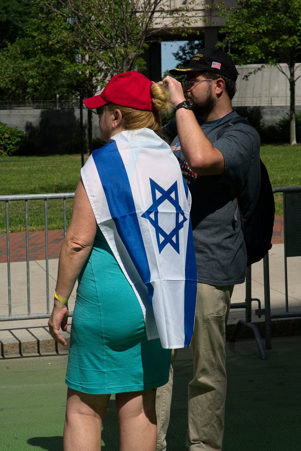 This Israeli-flag draped woman was the gatekeeper at one entrance to the barricaded Straight Pride rally on City Hall plaza.