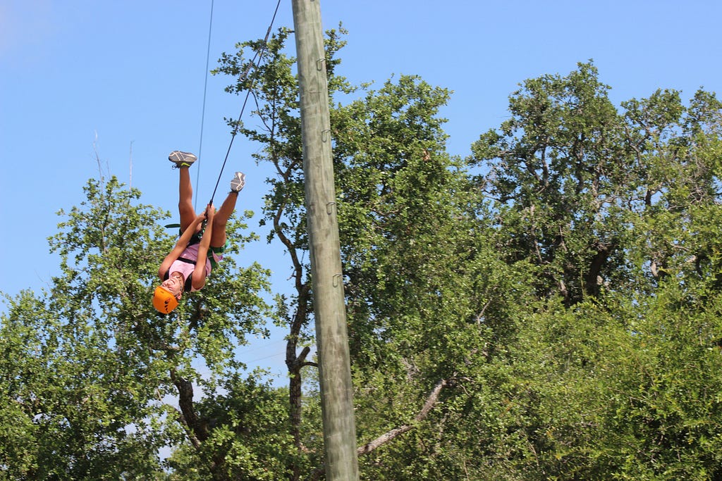 camper on the screamer flips upside down as she soars through the air