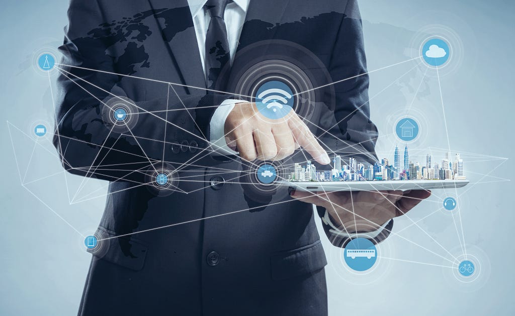 Businessman holding a tablet shows a city skyline using virtual screen smart