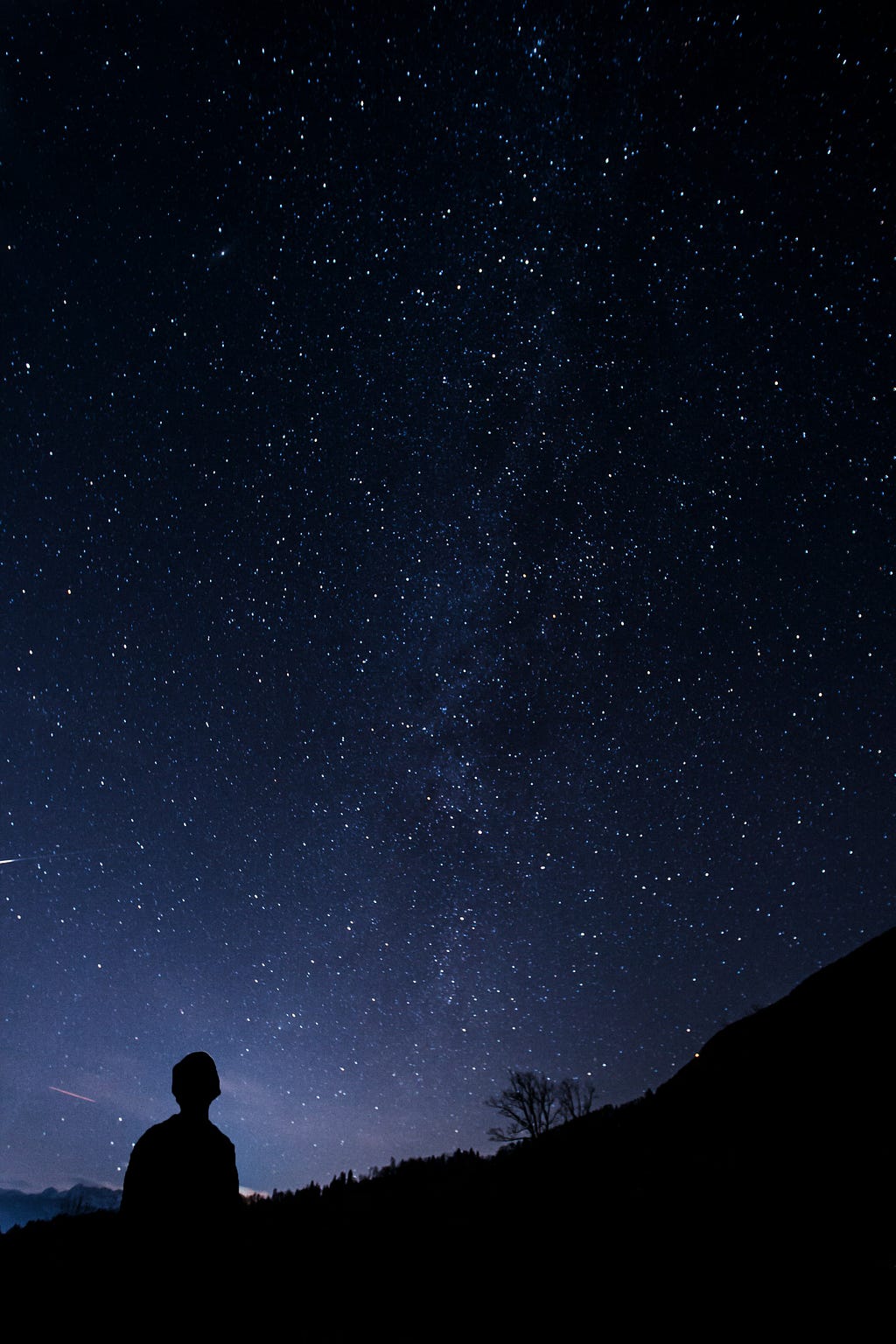 A man looking up at the stars