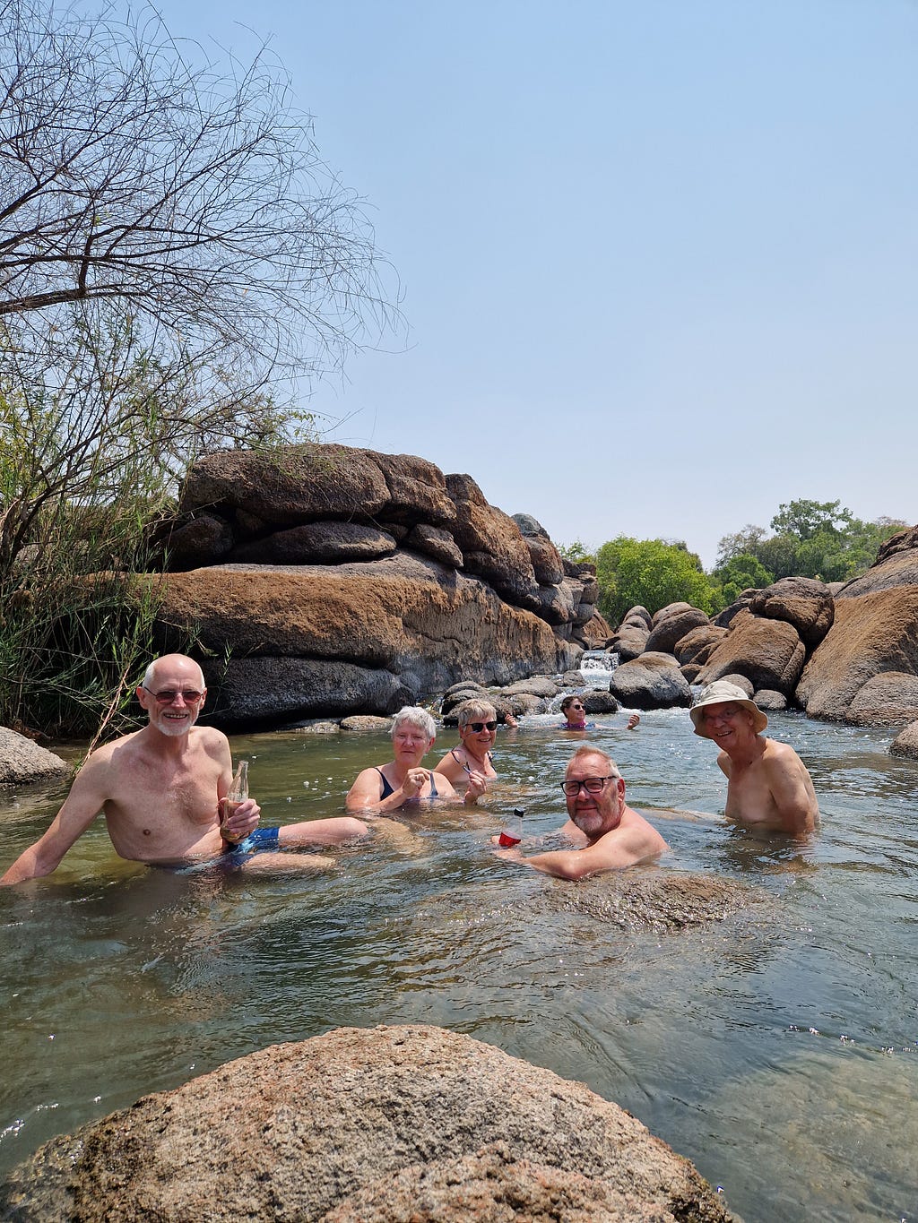 Adult humans in a river.