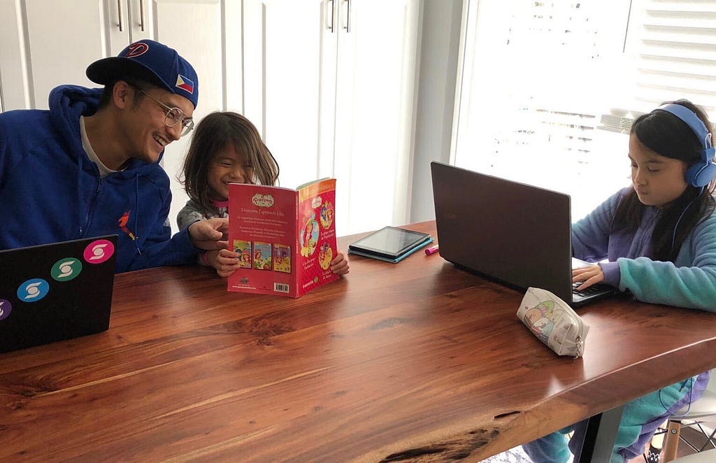 Digital marketing manager Jay at his kitchen table with his two kids