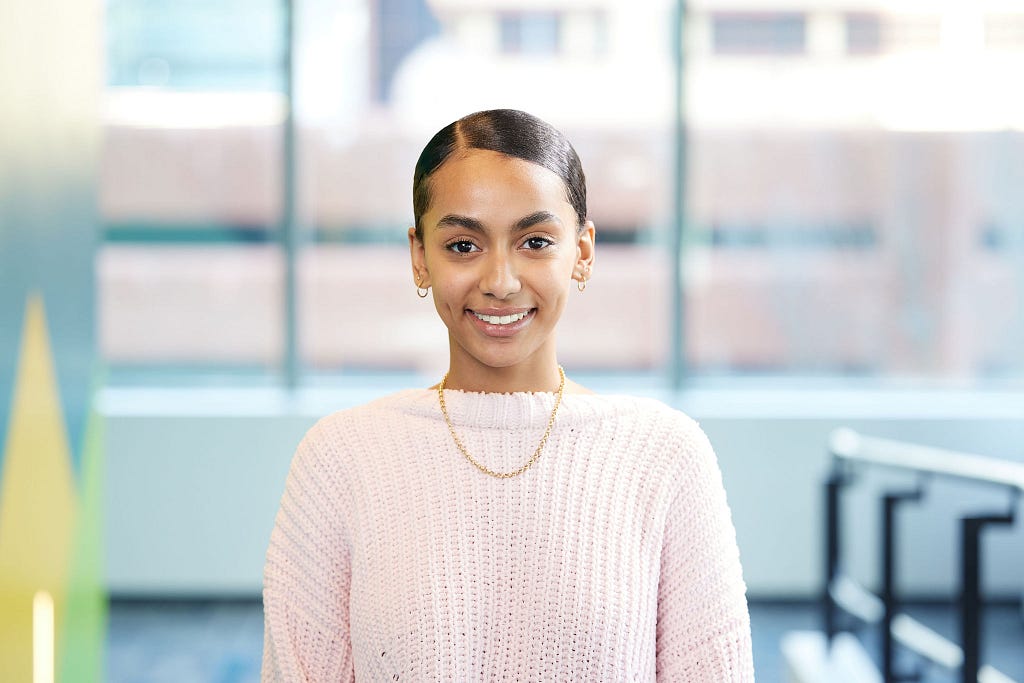 Victoria Mulugeta smiles at the camera.