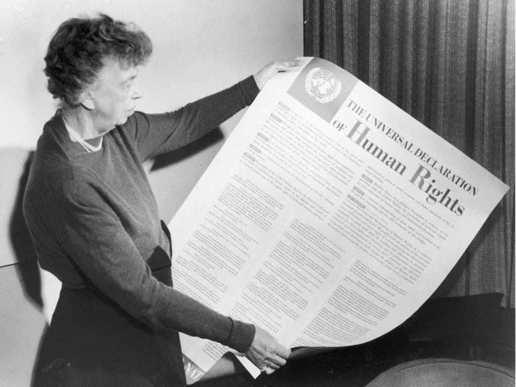 Eleanor Roosevelt holds up a copy of The Universal Declaration of Human Rights, adopted by the United Nations in December 1948.