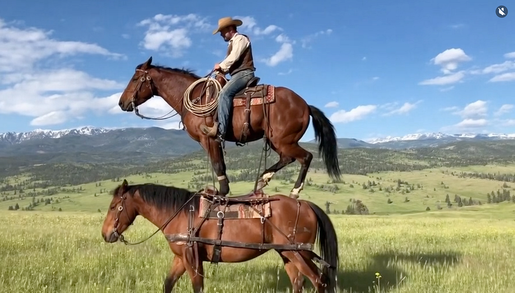 Still from a video generated with Sora. A man rides a horse which is on top of another horse