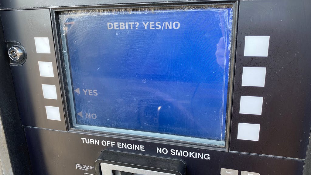 The blue payment screen at a gas pump that asks if you’re using a debit card.