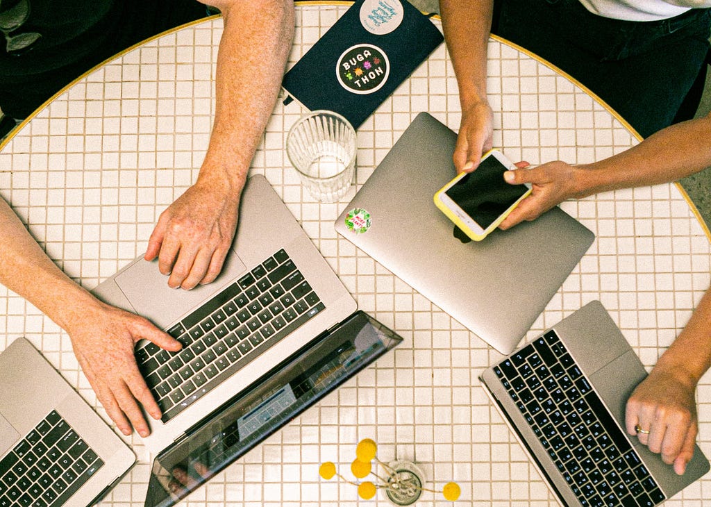 Photo of people using laptops