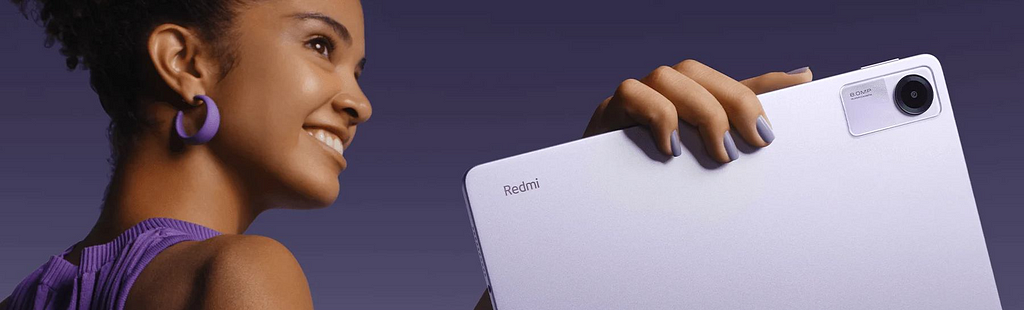 Woman holding purple Redmi Pad SE