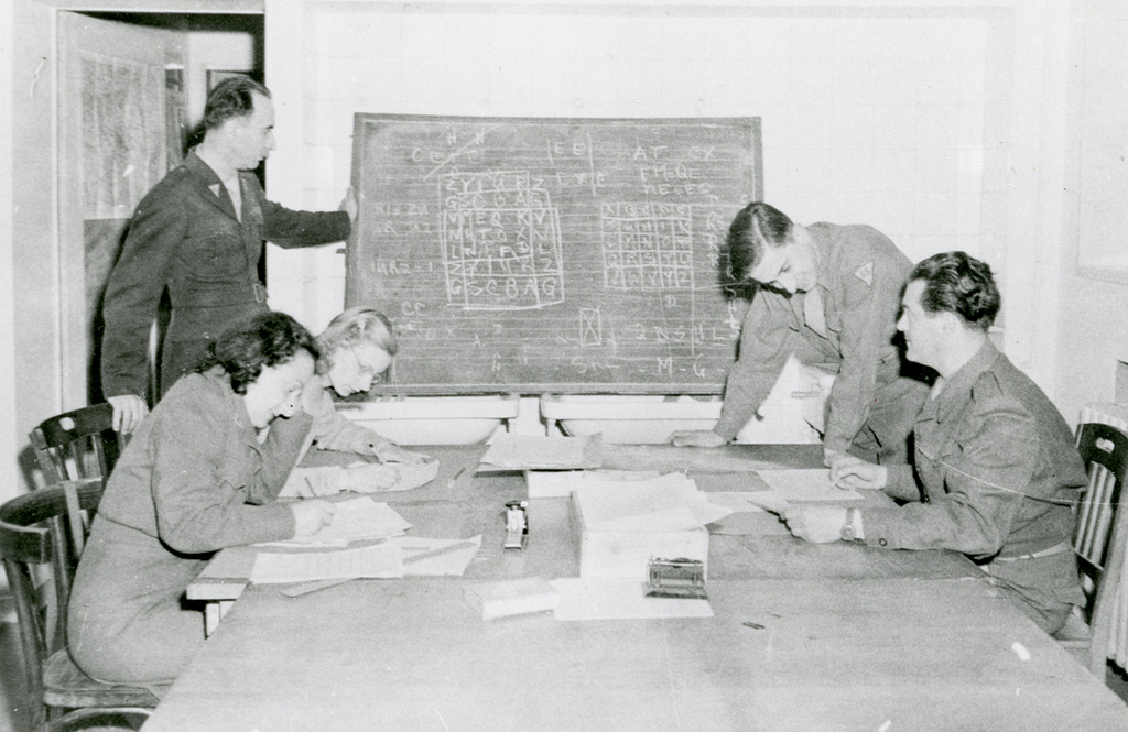 Army and Navy Code Breakers working on a code.