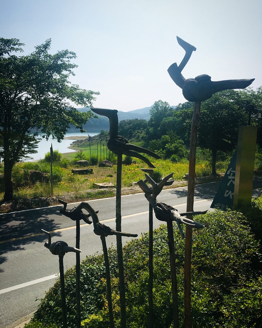 Wooden figures that resemble birds, overlooking the beautiful Hangang river in Jecheon, South Korea.