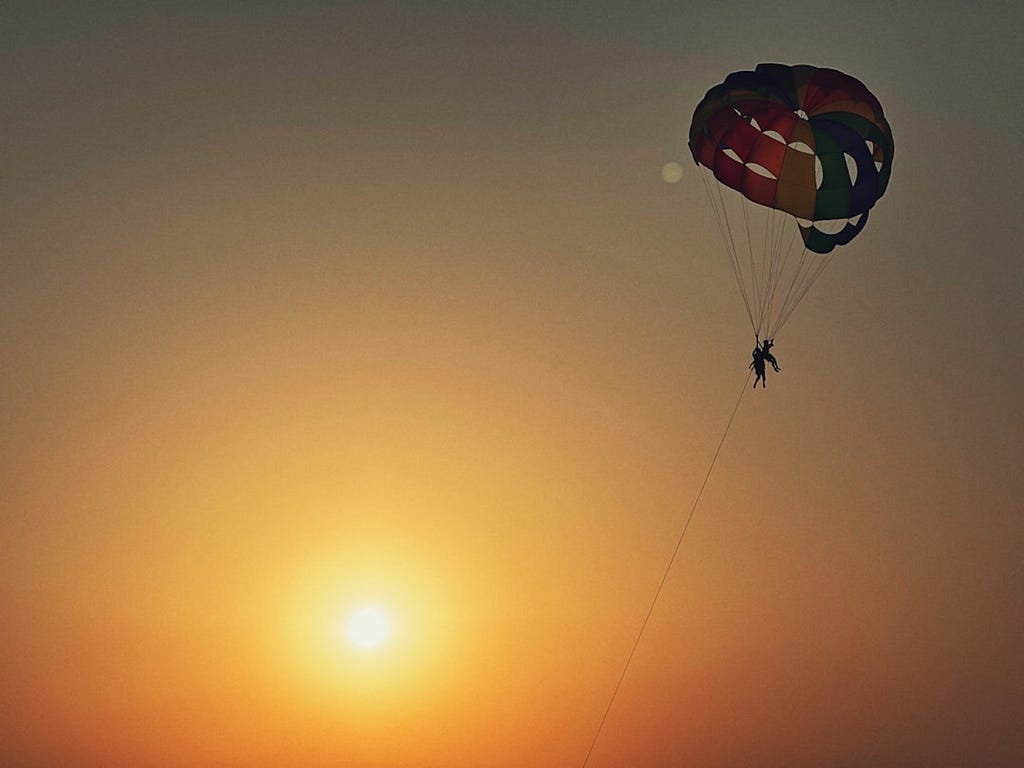 Om Kamath took this photo of someone paragliding at sunset.