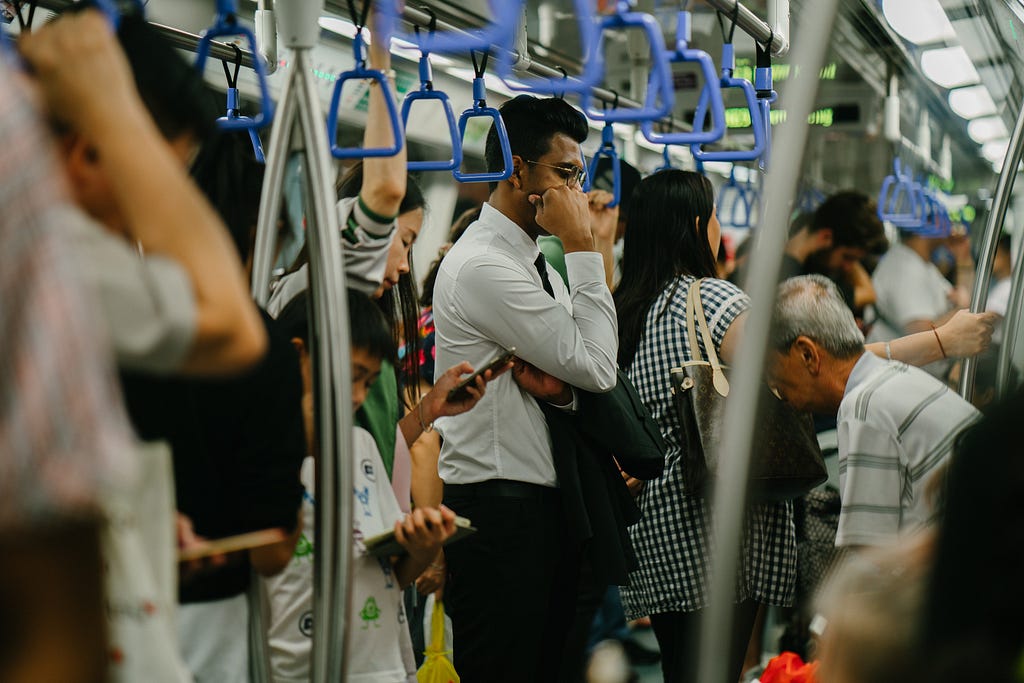 A man standing in the subway.