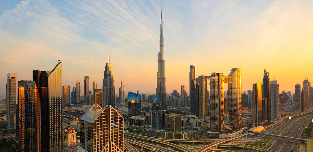 Aerial view of Dubai Downtown with visible Burj Khalifa during sunset