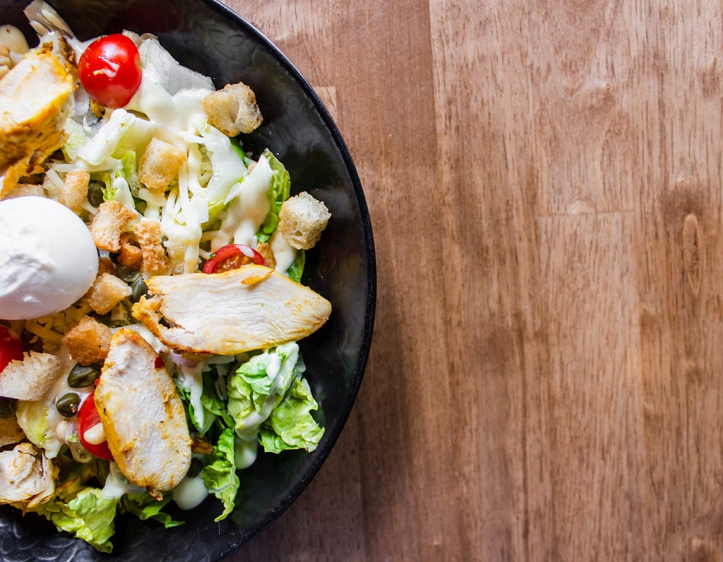 salad with chicken, cheese and lots of healthy toppings