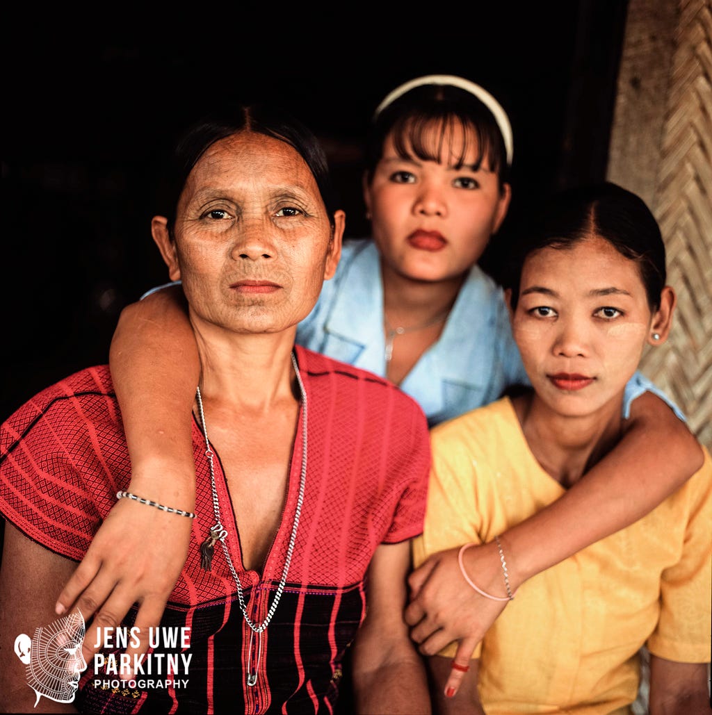 Female Laytu Chin Tattoo Master from Taung Gyi village in Western Rakhine, together with her two daughters.