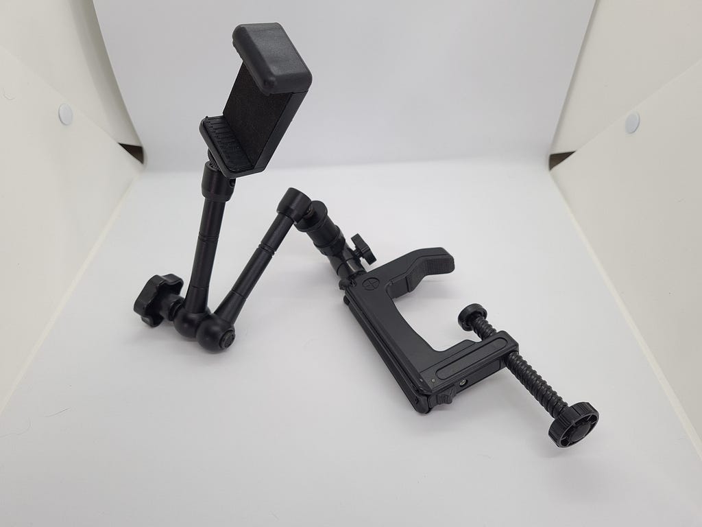 Figure 10. A “magic arm” mount with an attachment clamp and a phone clip.