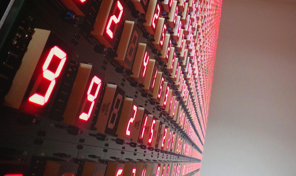 neon display of strings of numbers