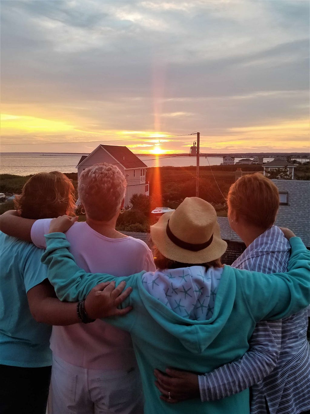 D with 3 of her best friends watching the sunset at beach house in Rhode Island