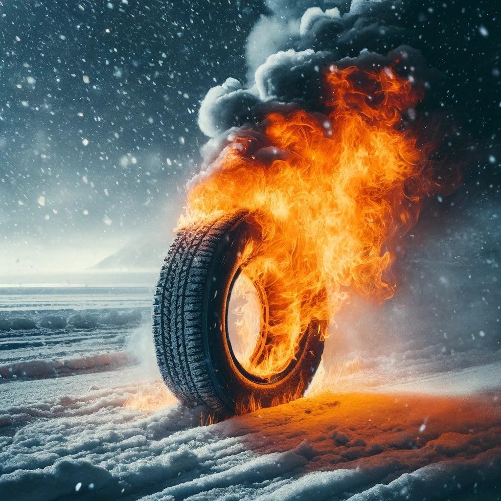 An intense scene of a tire ablaze with orange flames against a snowy winter background, with snowflakes falling around and smoke rising into the cold air.