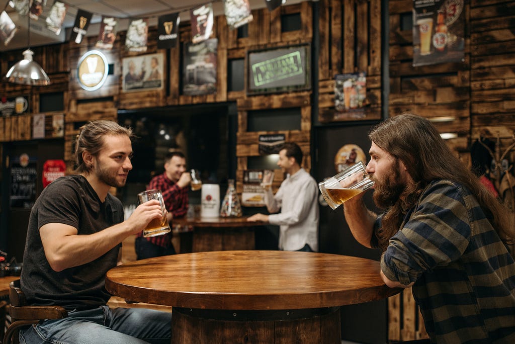 Two men drinking beer together