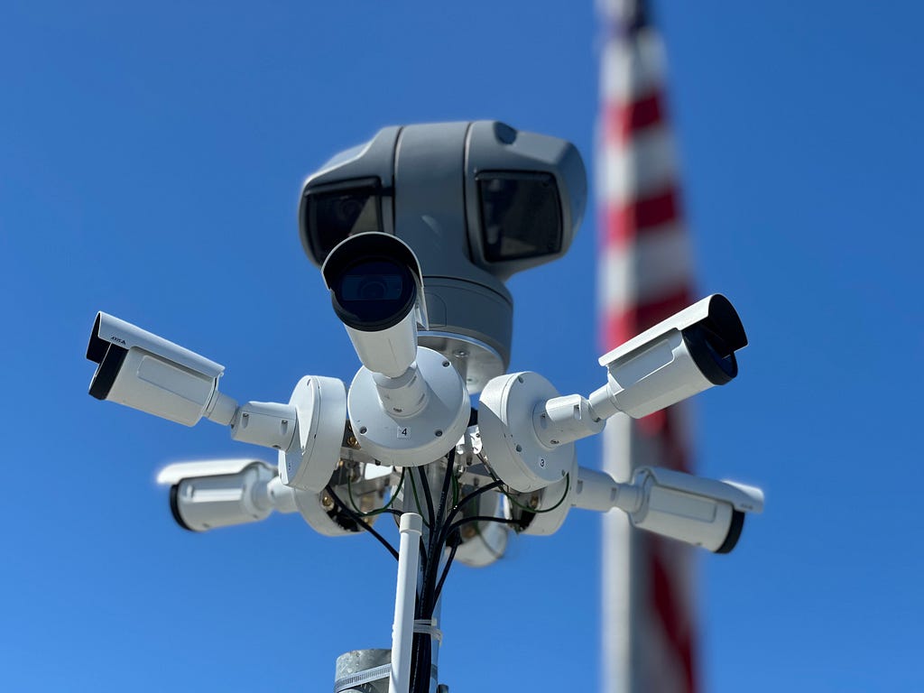 Rooftop camera setups, like this one at Campbell PD in California, relay footage of airspace to drone operators below in the flight room. This view of the airspace enables the pilots to remotely fly drones safely.