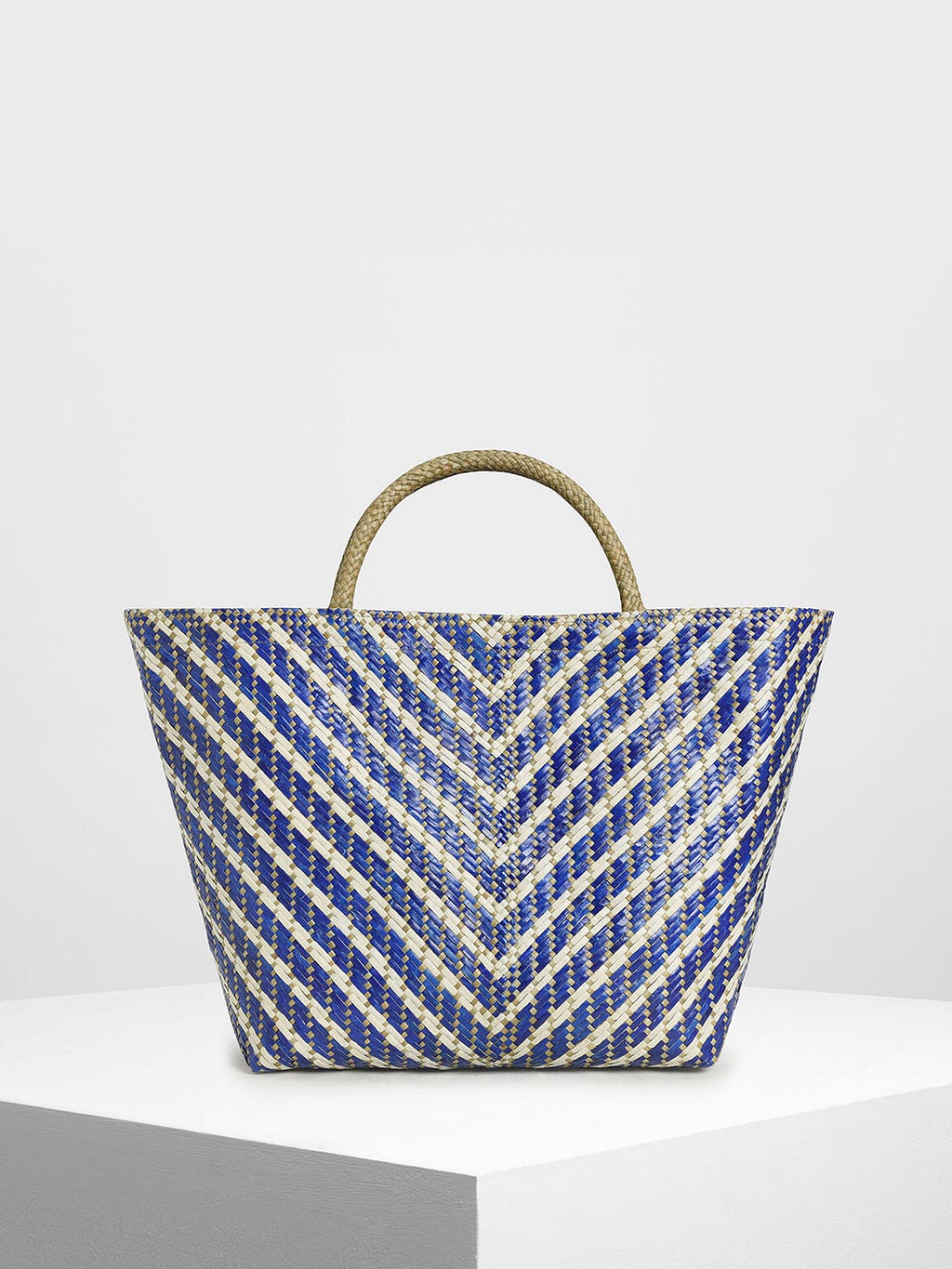 charles-&-keith-woven-banig-bag-blue-gold-triangular-pattern