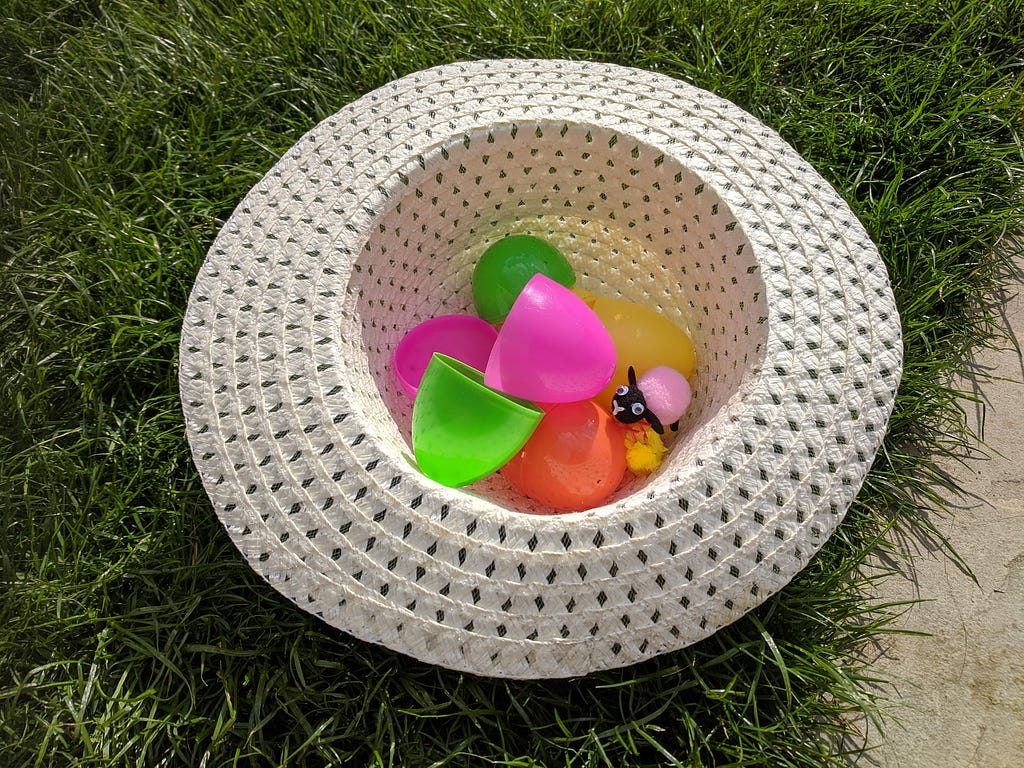 Plastic Easter eggs in a sun hat