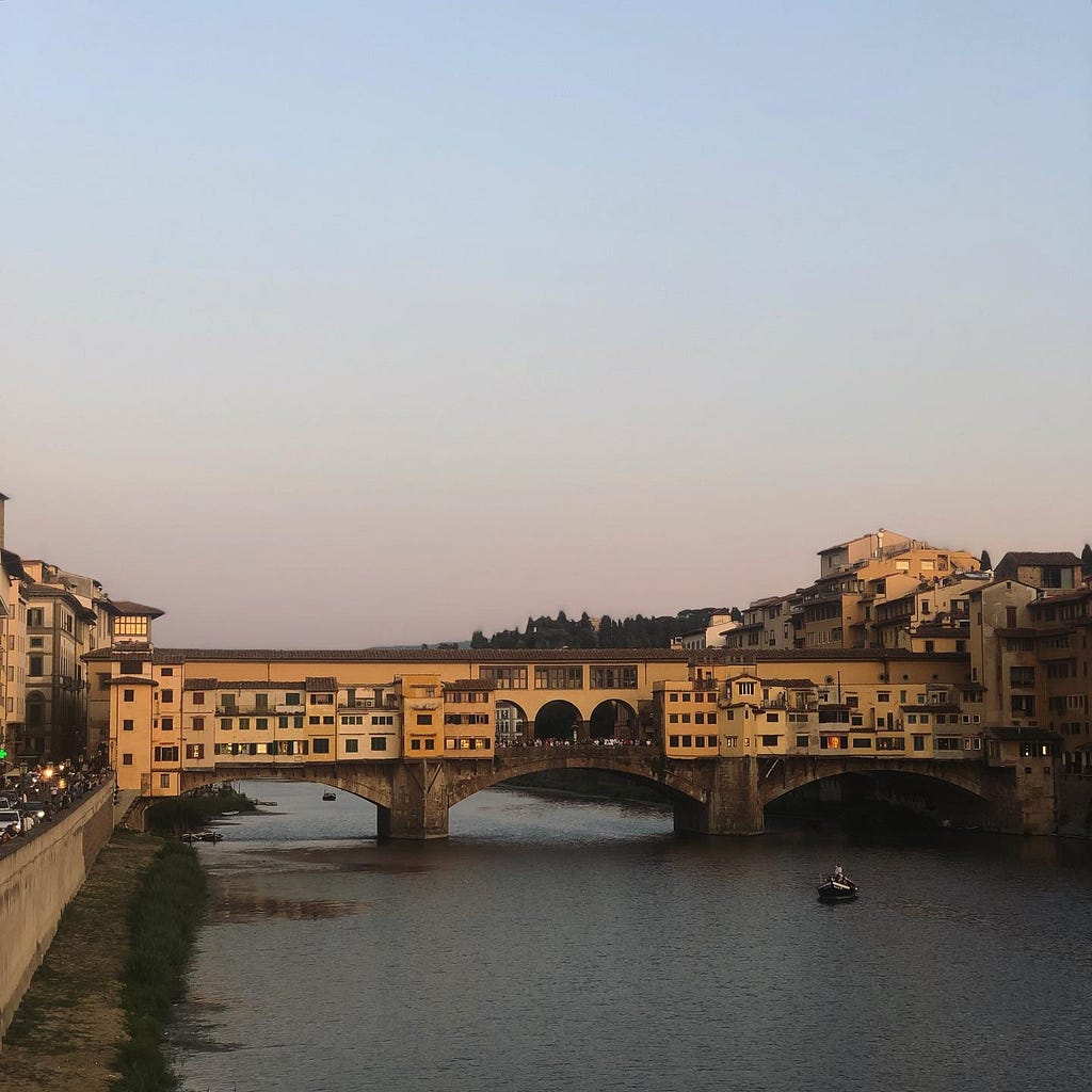 Ponte Vecchio in Florence, Italy at sunset, looking east.
