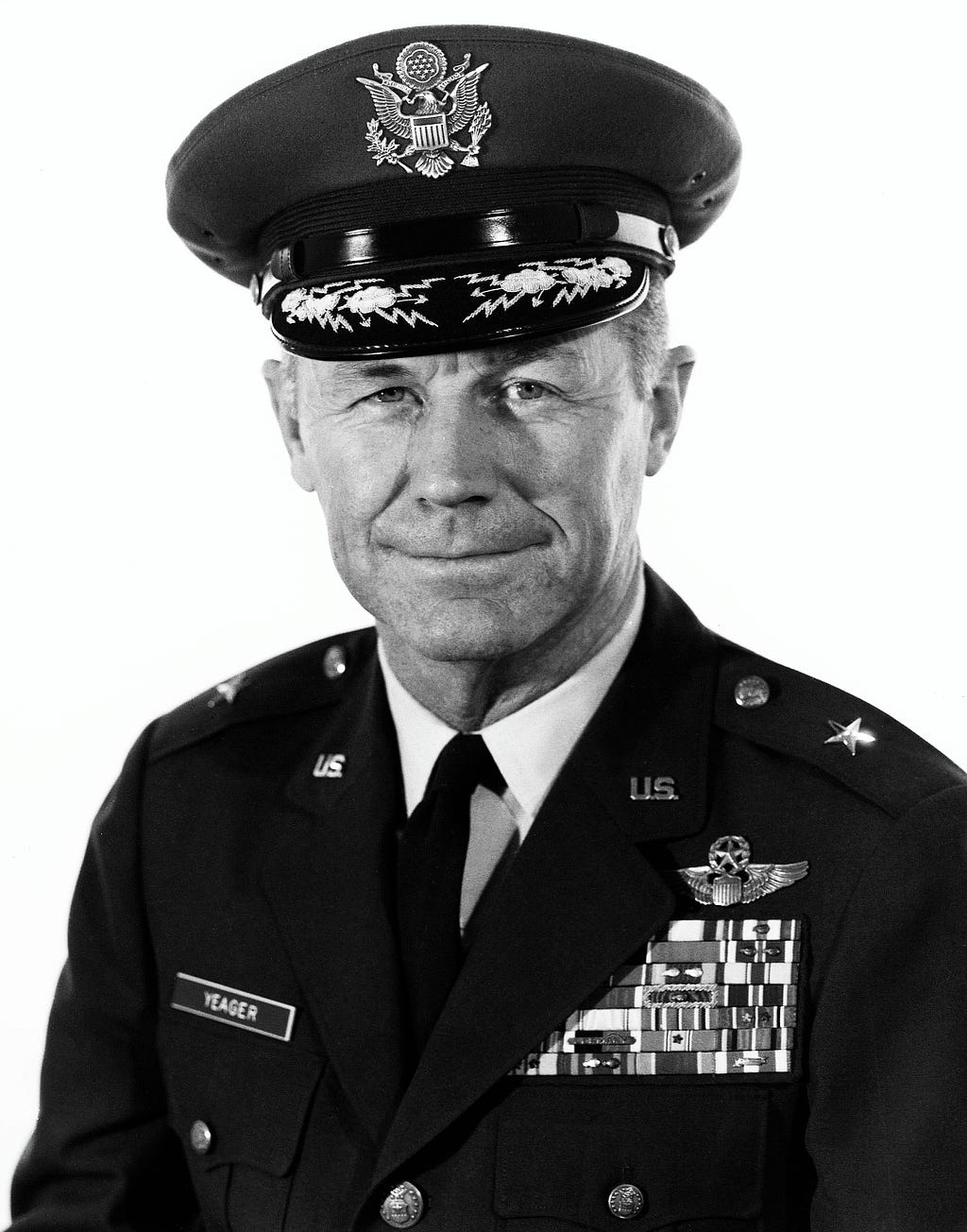 Black and white photo portrait of Chuck Yeager in his uniform.