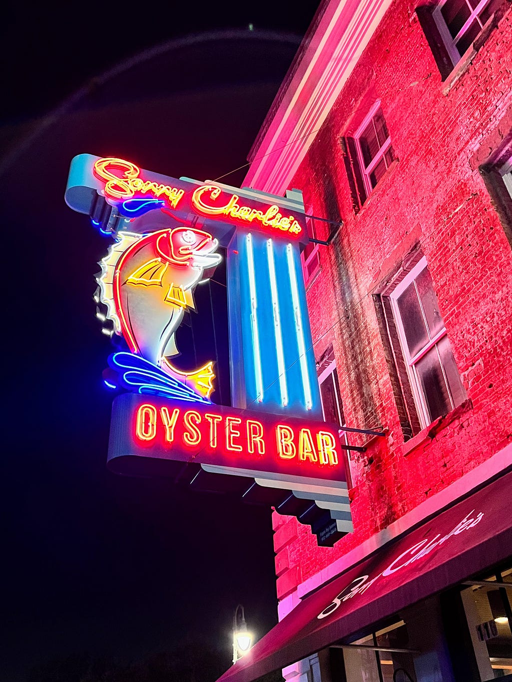 Sorry Charlie’s Oyster Bar; neon sign with a brightly colored fish