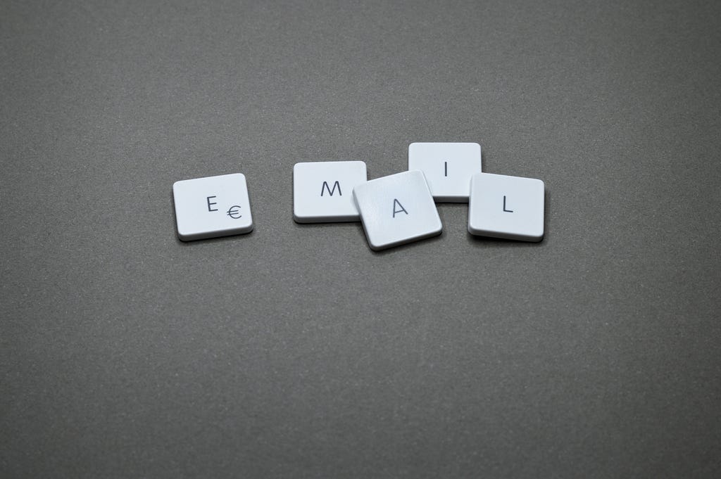 The picture says, “Email” in individual scrabble game pieces