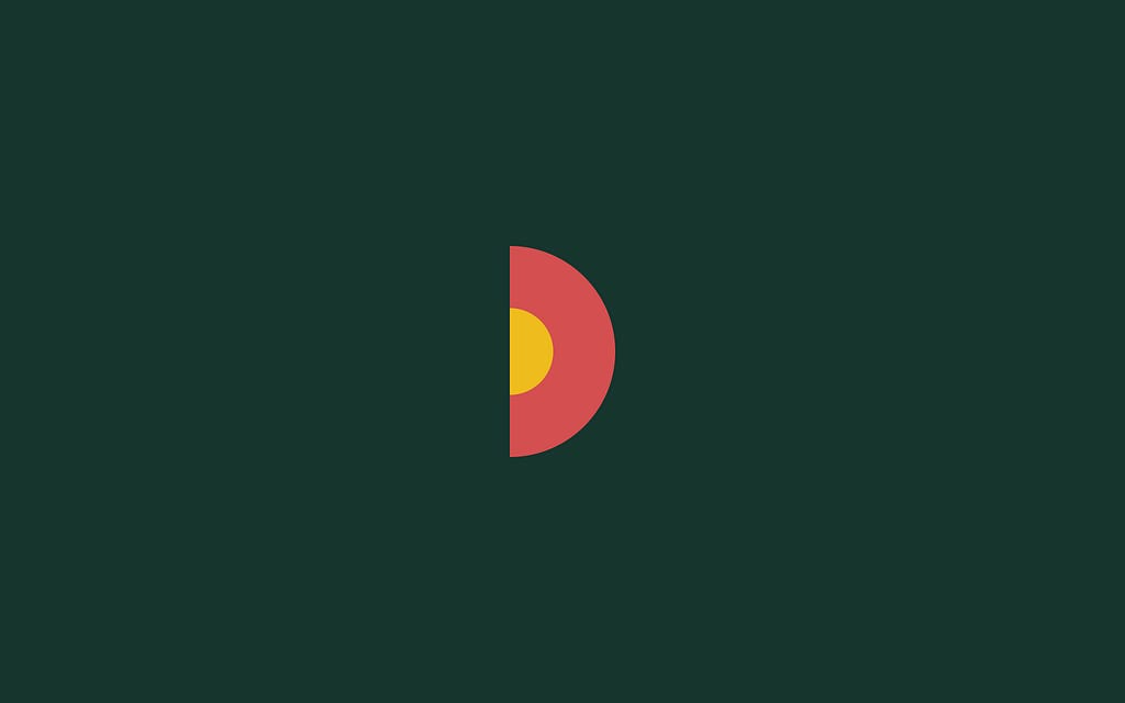 An abstract, geometric half-moon shape in red, yellow, and dark green.
