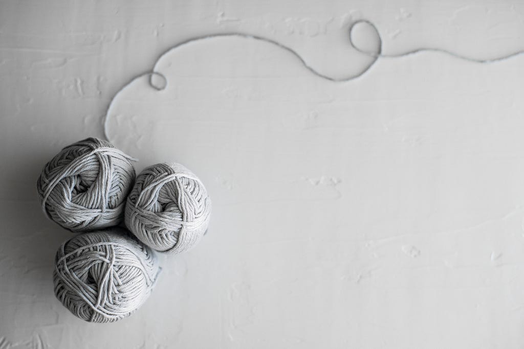 Photo of three balls of yarn… cuz ya know, this post will be talking about yarn.