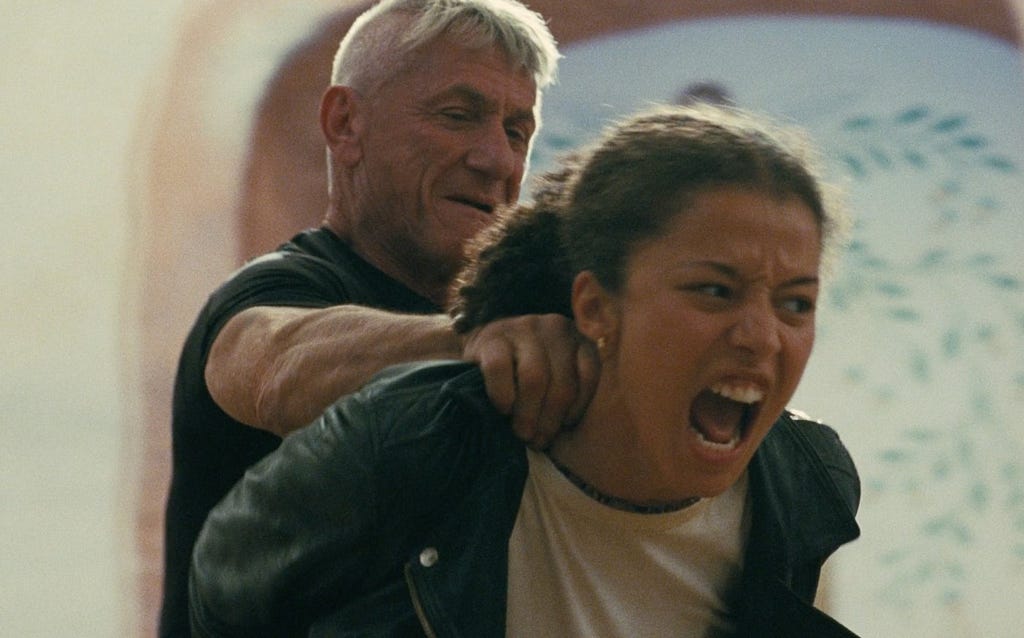 Willa screaming and fighting against Col. Lockjaw with bound hands, while he holds onto her shoulder