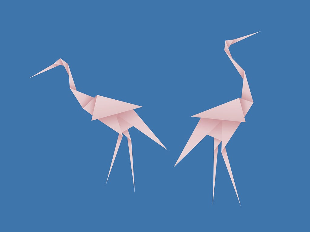 A photo of two pink flamingo paper origamis.