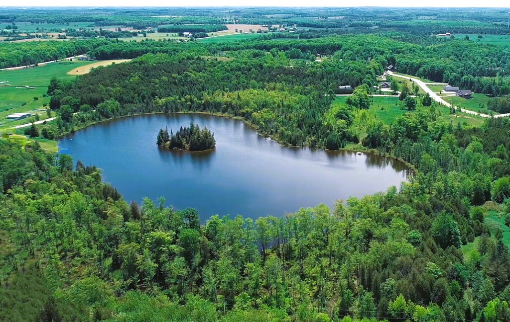 The 54-acre piece of land, this exclusive property boasts an estimated 25-acre private lake, providing a secluded, serene environment away from the bustle of city life.