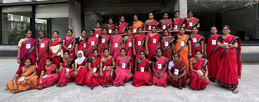 Participants of Chitrika’s handmade MBA program pose together in red or pink sarees at their convocation on 30 January in Hyderabad